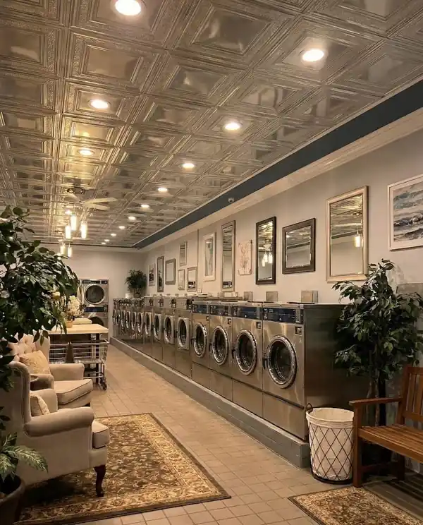 Modern laundromat interior with clean washers and dryers
